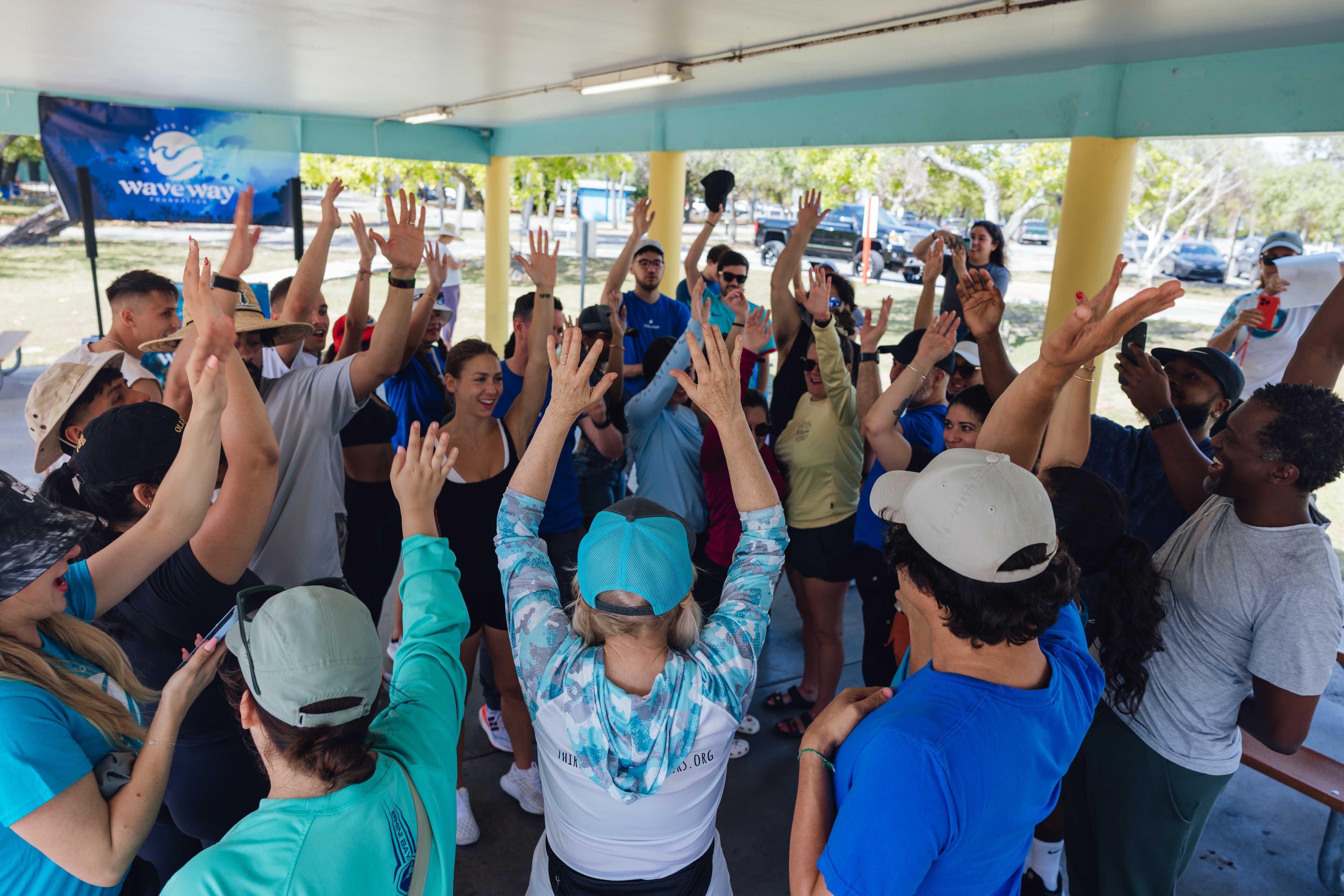 Volunteers doing group huddle